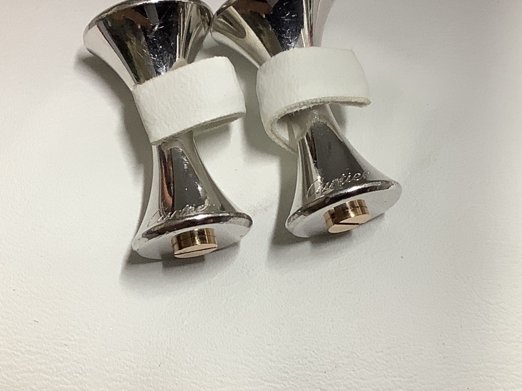 A modern pair of Cartier 925 and yellow metal cufflinks, modelled as a pair of dumbbells, 23 mm.